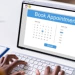 Person booking appointment on iPad.